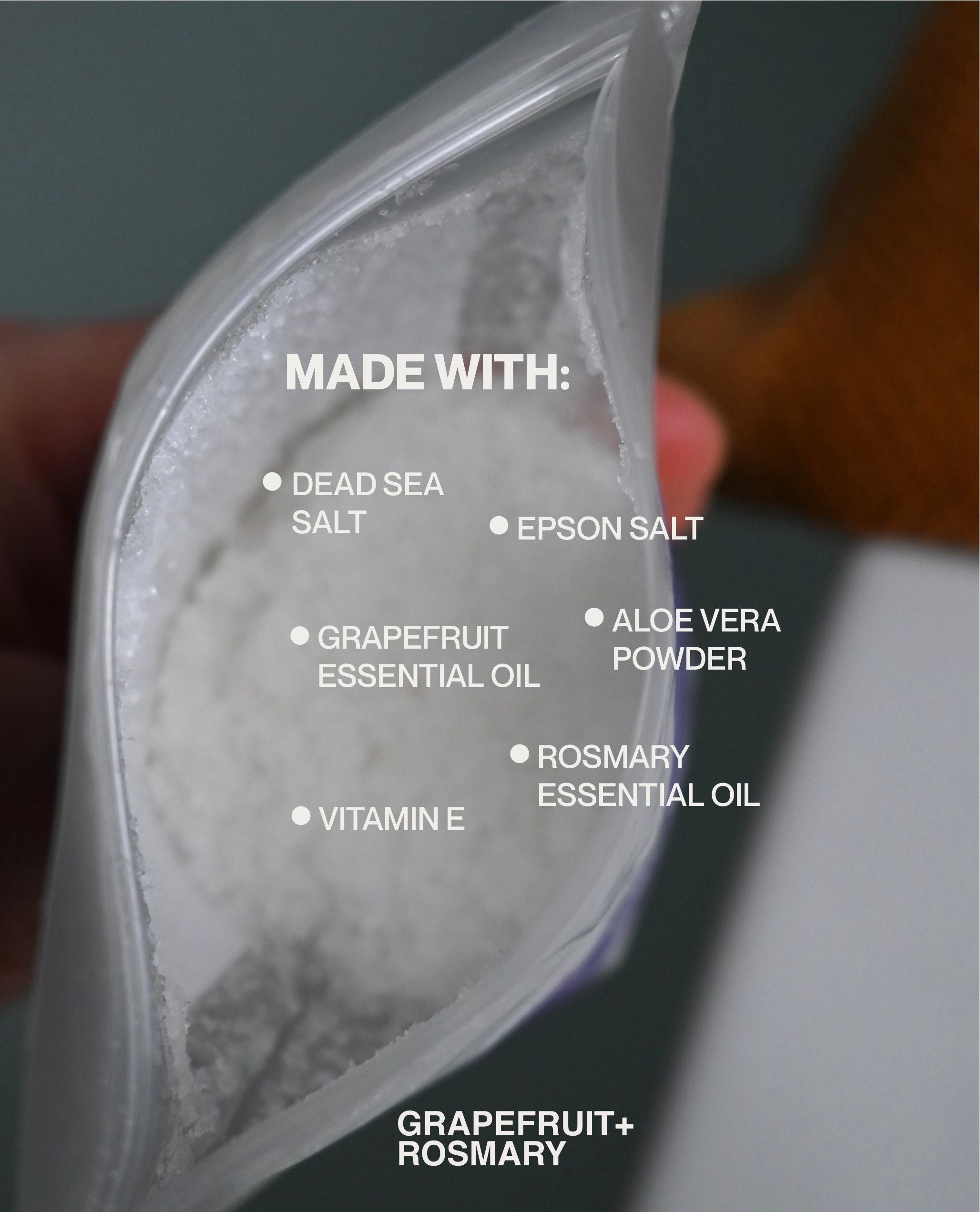 Close-up of Grapefruit + Rosemary bath salts with mineral and botanical ingredients