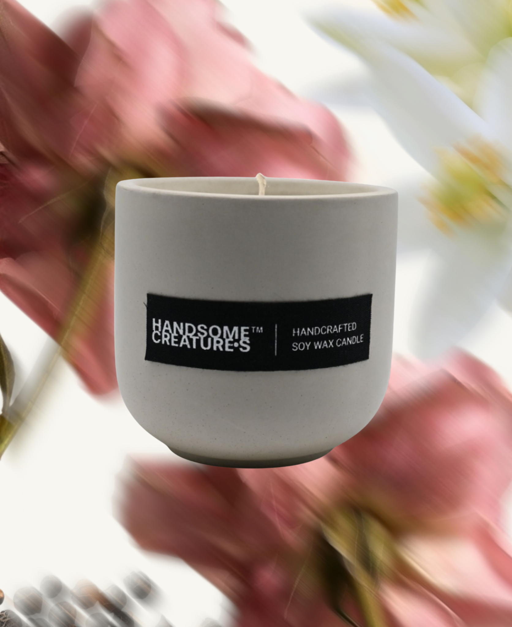 Handsome Creatures soy wax candle in minimalist ceramic vessel with rose and black pepper-inspired background