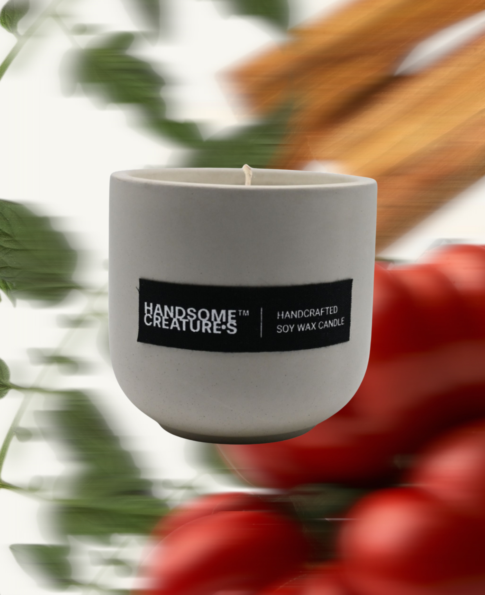Handsome Creatures soy wax candle in minimalist ceramic vessel with tomato-inspired background